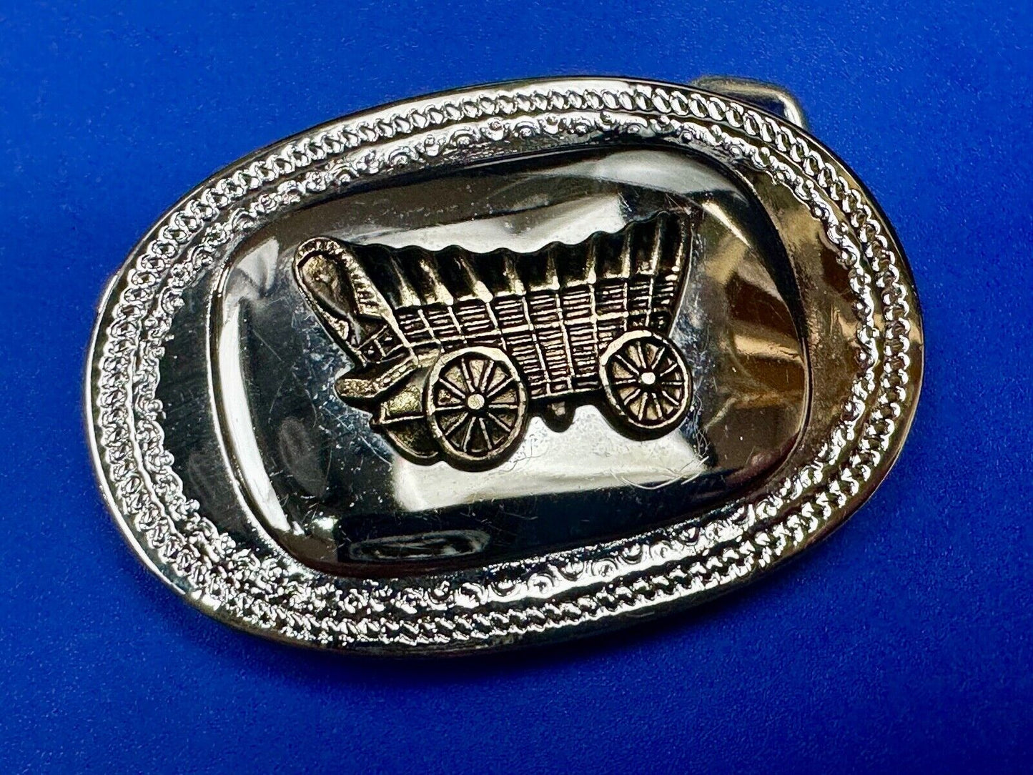 Vintage Covered Wagon on reflective oval two tone western belt buckle
