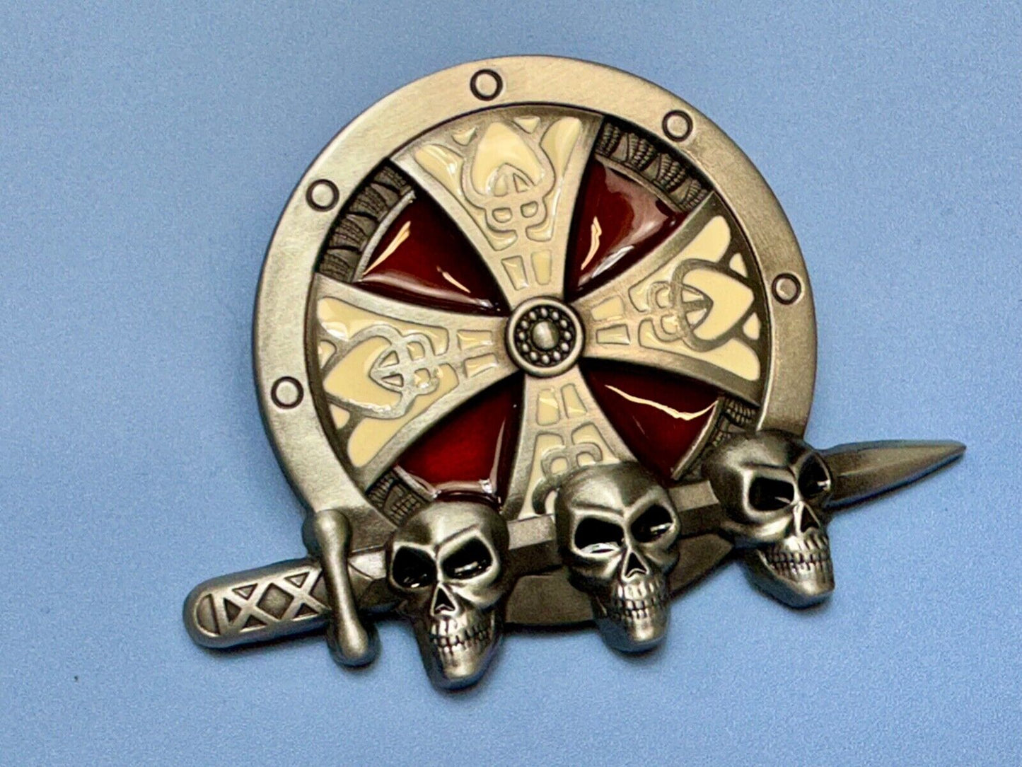 Three skulls with sword through heads on Iron Cross round NOS belt buckle