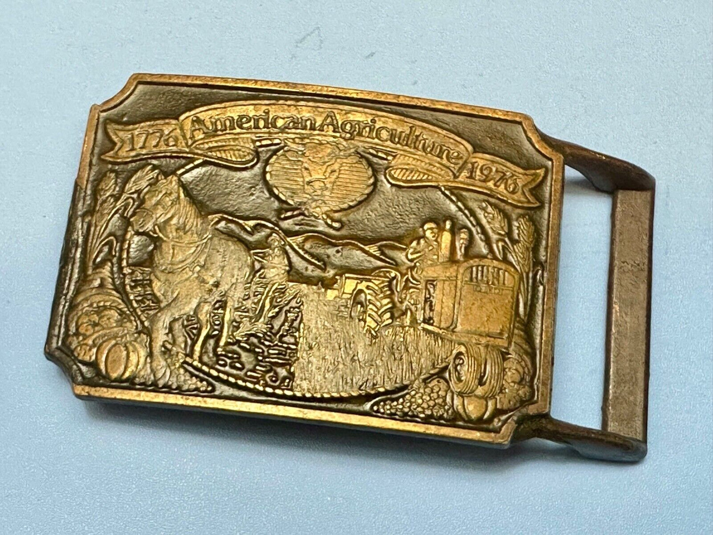 Bicentennial American Agriculture Horse to tractor, Vtg belt buckle by Ortho