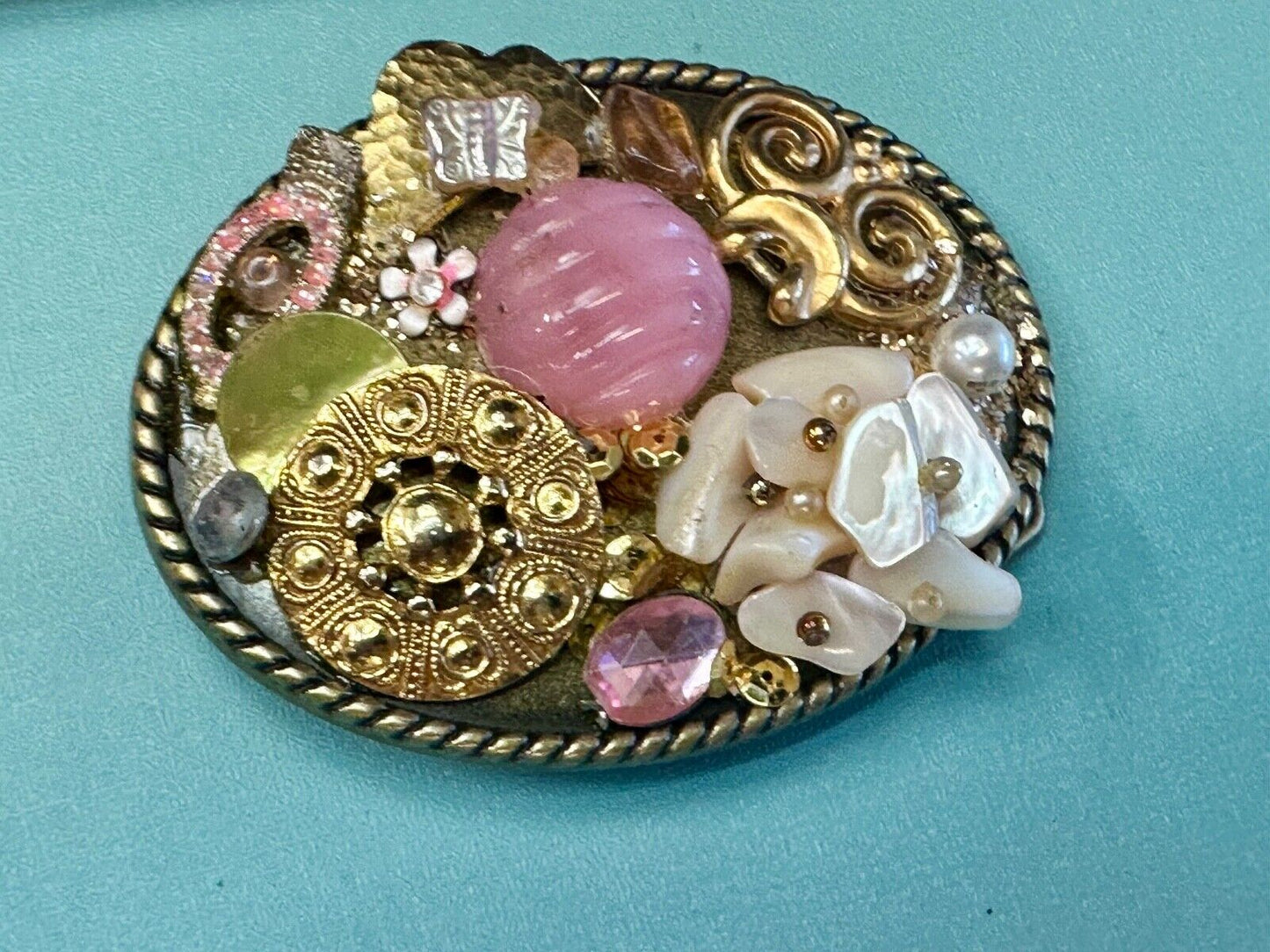 Artisan Abstract flowers made of mixed material on gold tone oval belt buckle