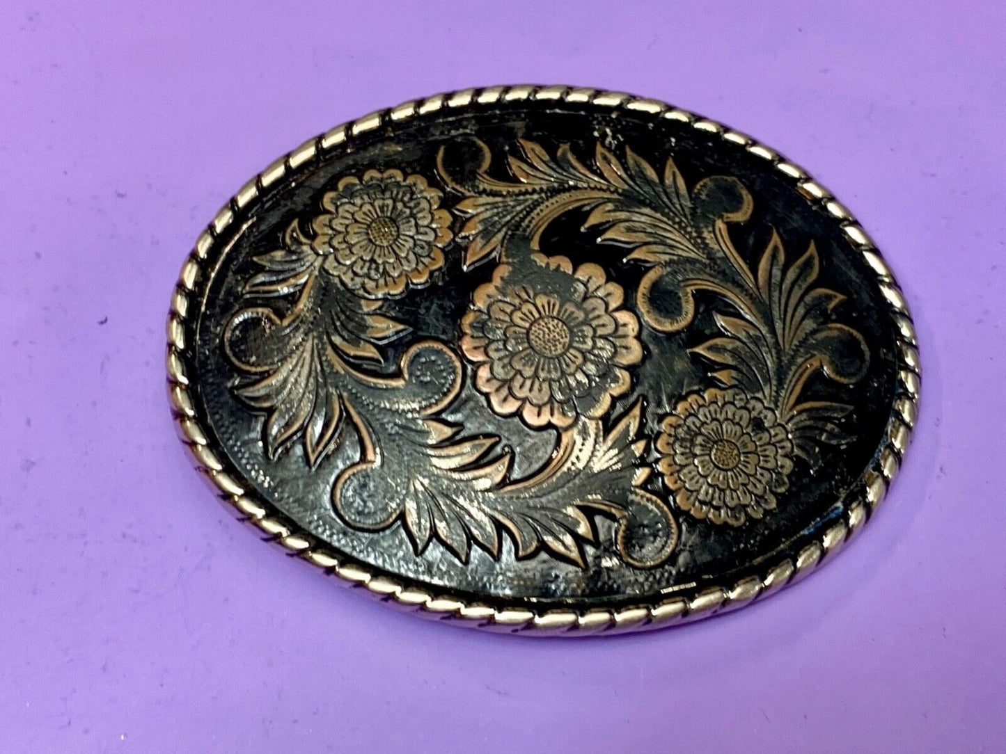 Beautiful flower design black & copper color oval outlined western belt buckle W