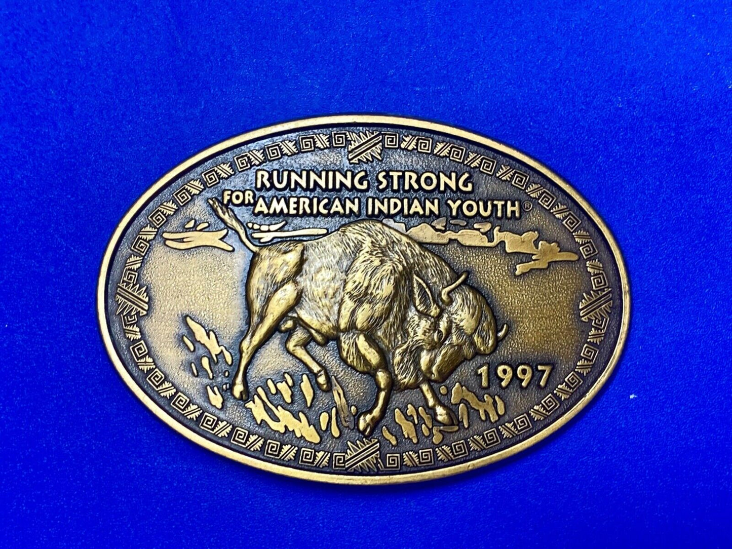 Vintage 1997 BUFFALO belt buckle RUNNING STRONG FOR AMERICAN INDIAN YOUTH
