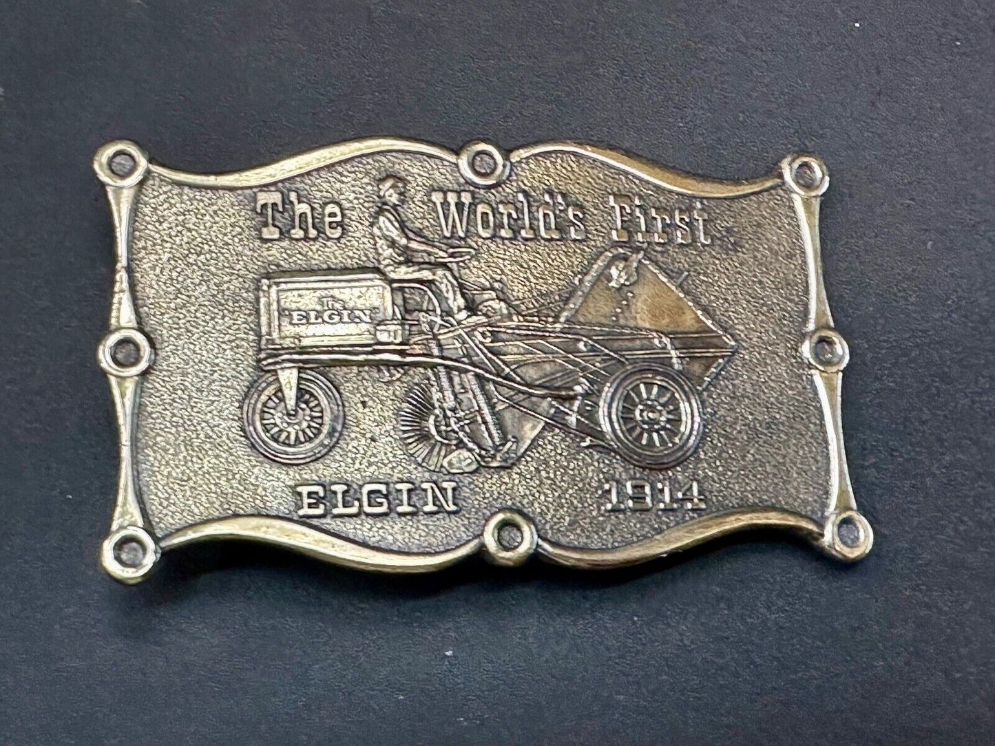 The Elgin, The worlds first tree sweeper commemorative belt buckle by Lewis