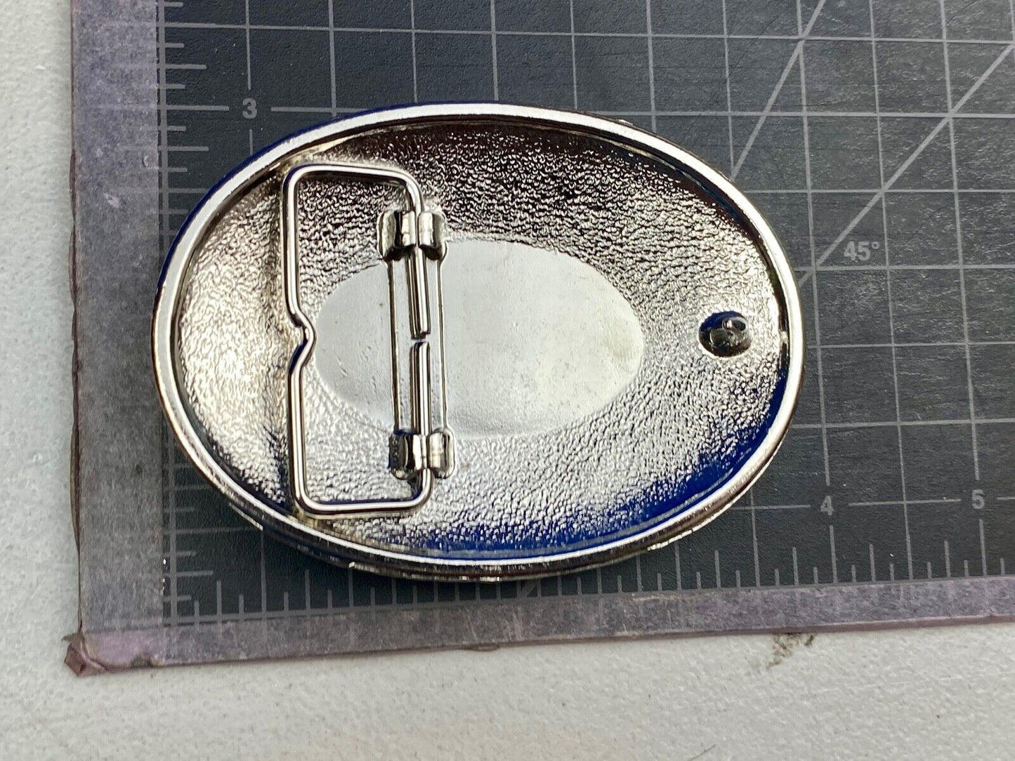 Beautiful belt buckle with centerpiece picture of Allied Cementing Company