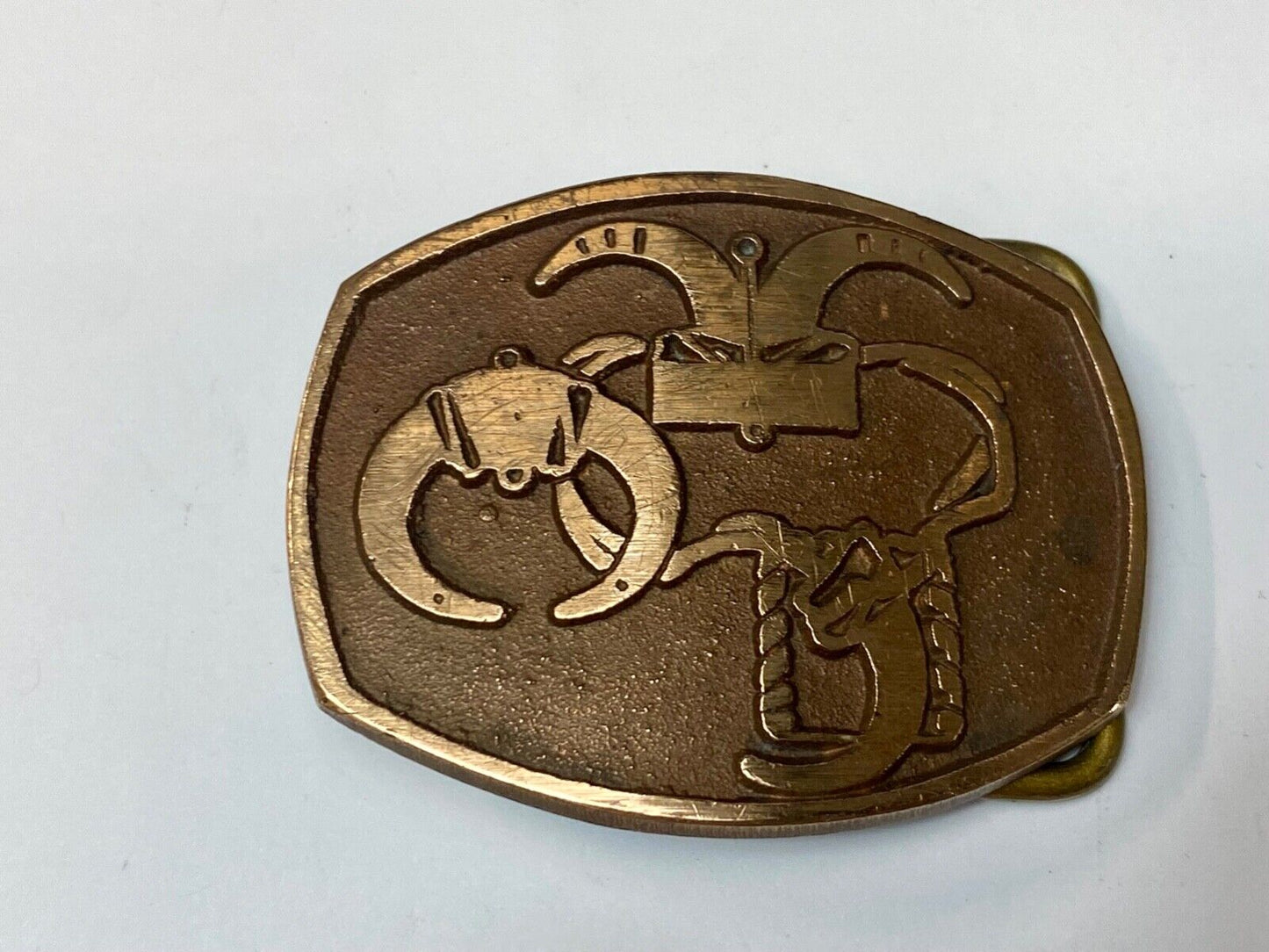 unknown to me - cattle branding symbols? longhorn western? belt buckle