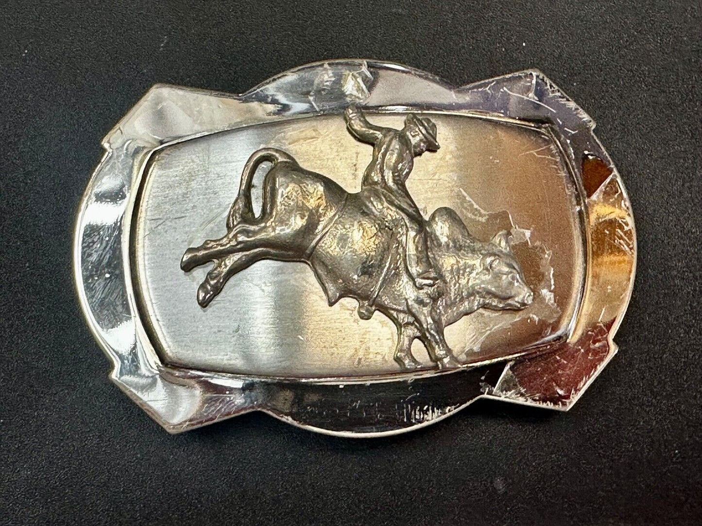 Vintage Cowboy Saddle Bronc on reflective two tone western belt buckle