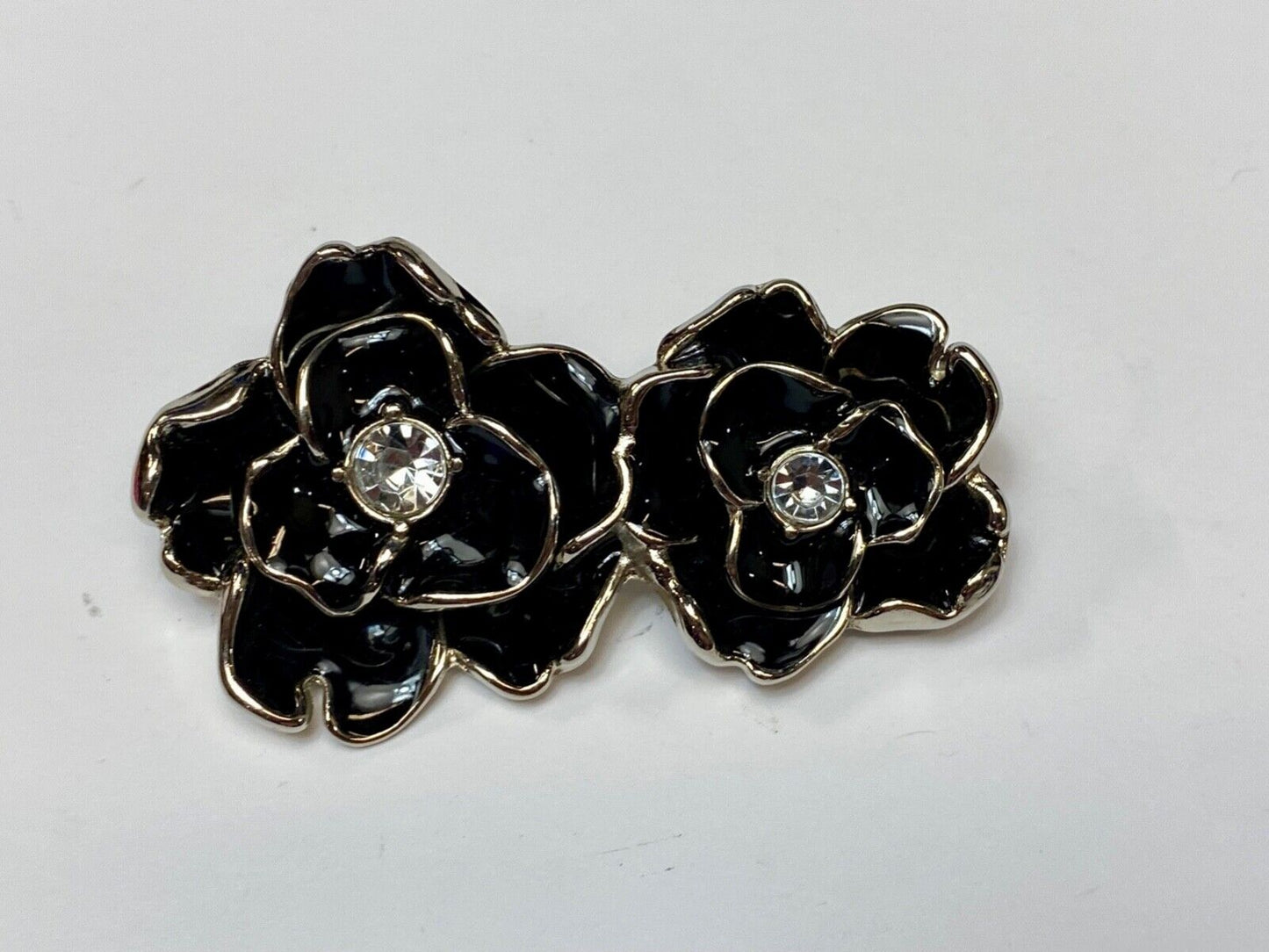 Beautiful two figural flowers with jewels as black & silver colored belt buckle