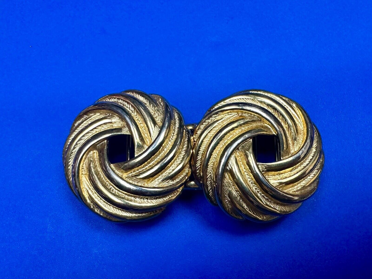 Two piece Round Swirl Interlocking gold color belt buckle by Douglas Paquette