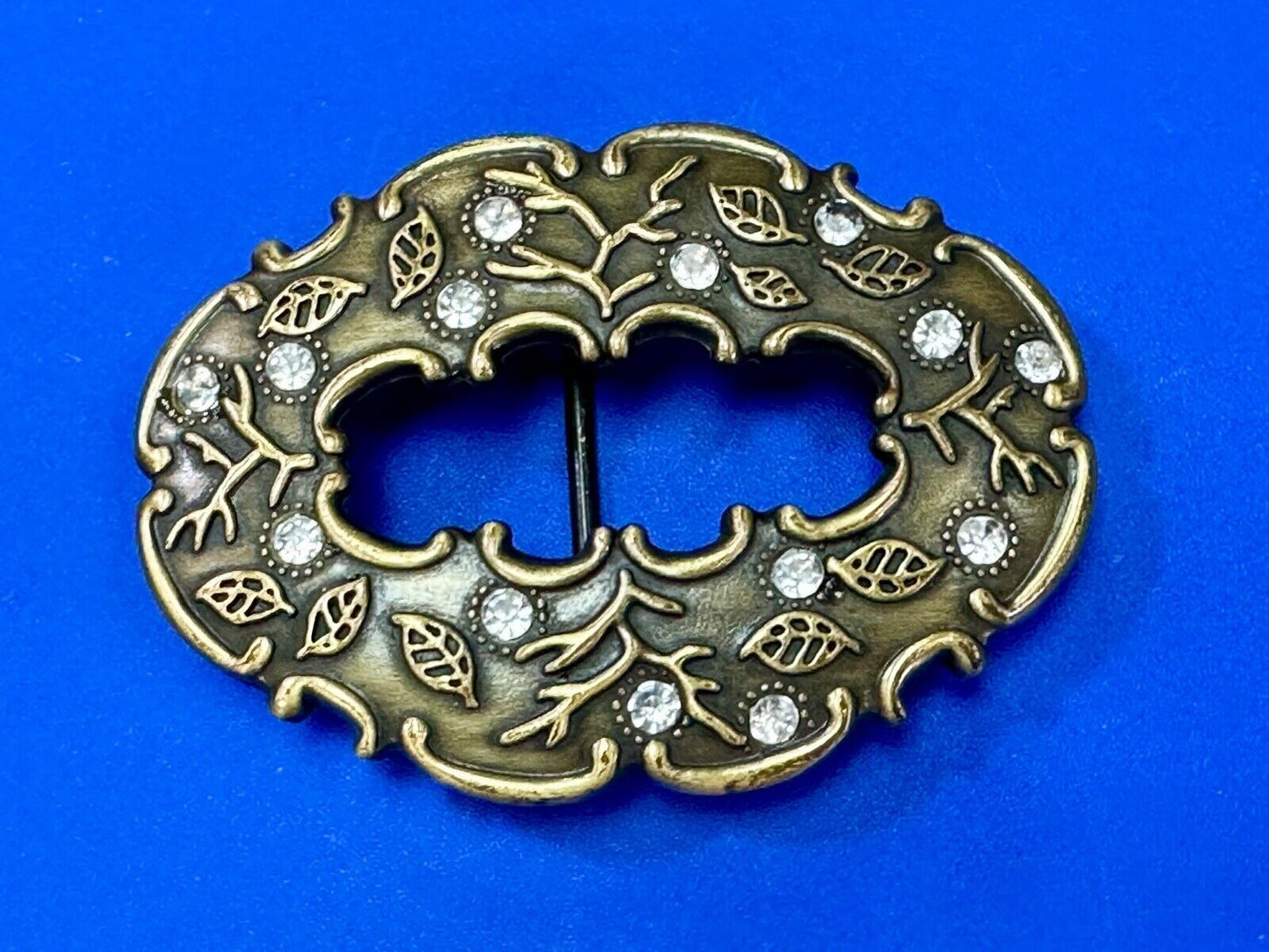 3" wide brown rhinestone accented leaf pattern semi oval belt buckle