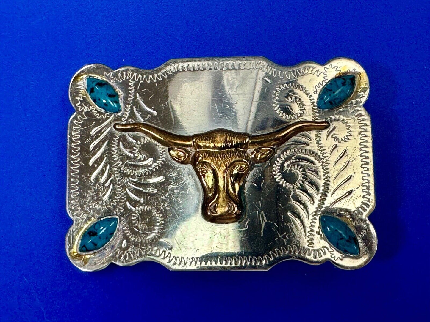 The Longhorn cow steer western nickel silver belt buckle with turquoise accents
