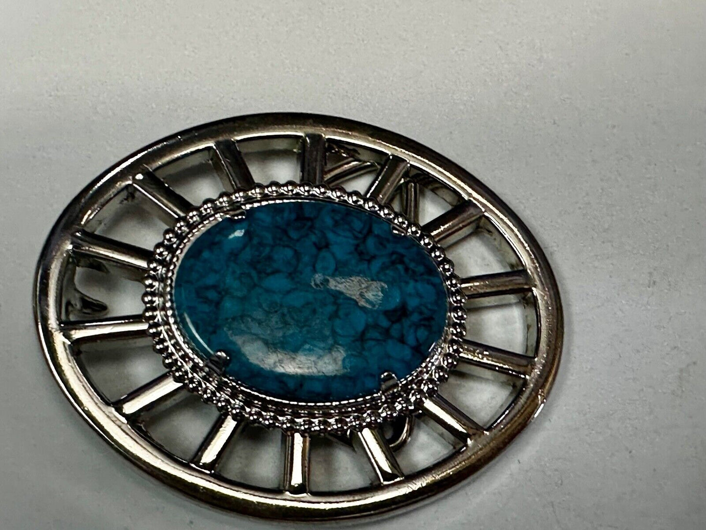 Synthetic Turquoise in unique see through silver tone round Belt Buckle