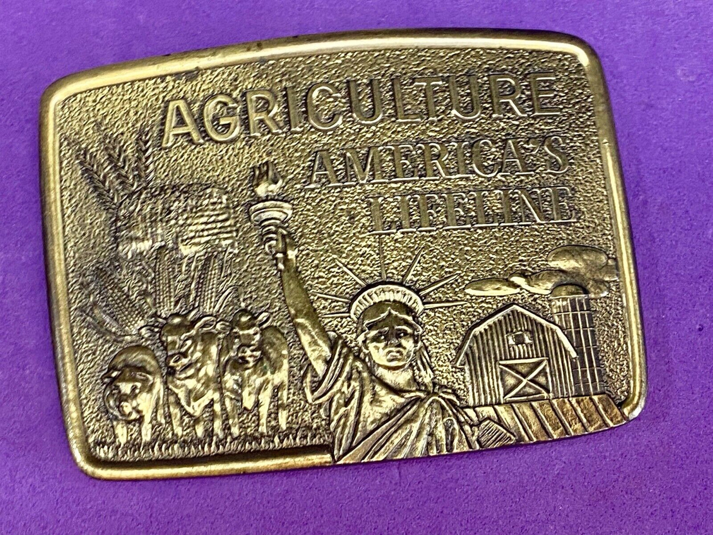 AGRICULTURE, Americas Lifeline belt buckle by Farmhand Statue of liberty