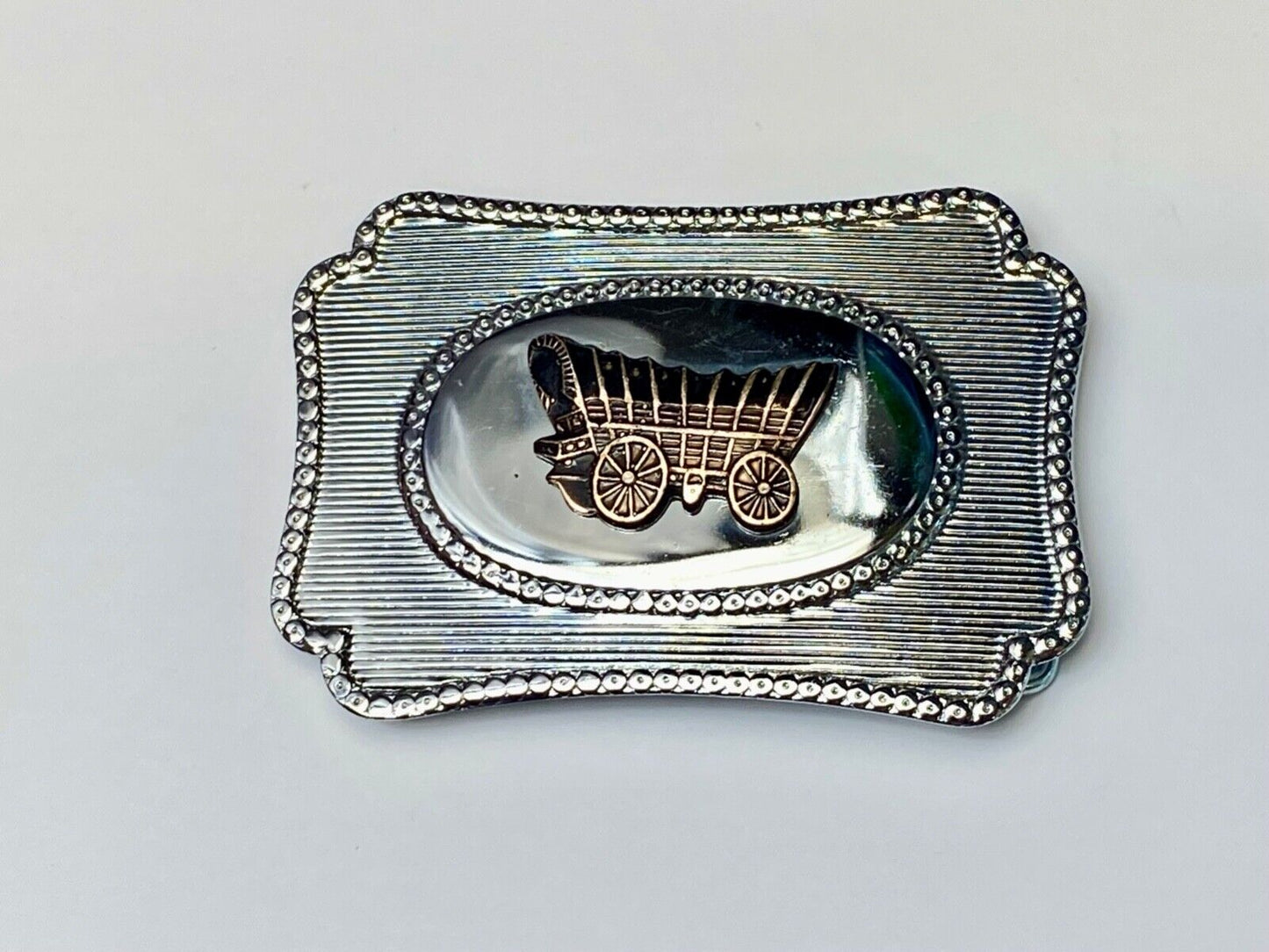 Vintage Covered wagon two tone reflective pre loved, western framed belt buckle