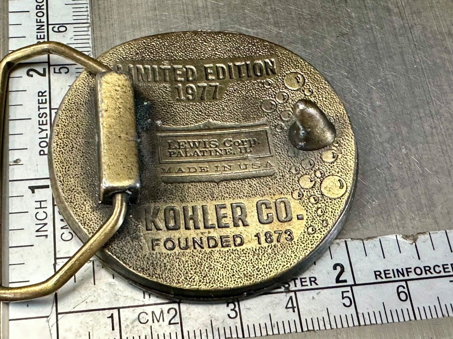 The Bold Look of Kohler Vintage 1977 Lewis round Limited Edition belt buckle