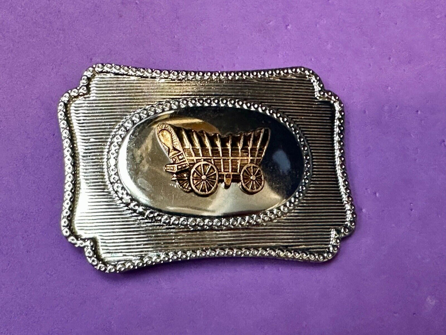 Vintage covered wagon western horse drawn transportation belt buckle