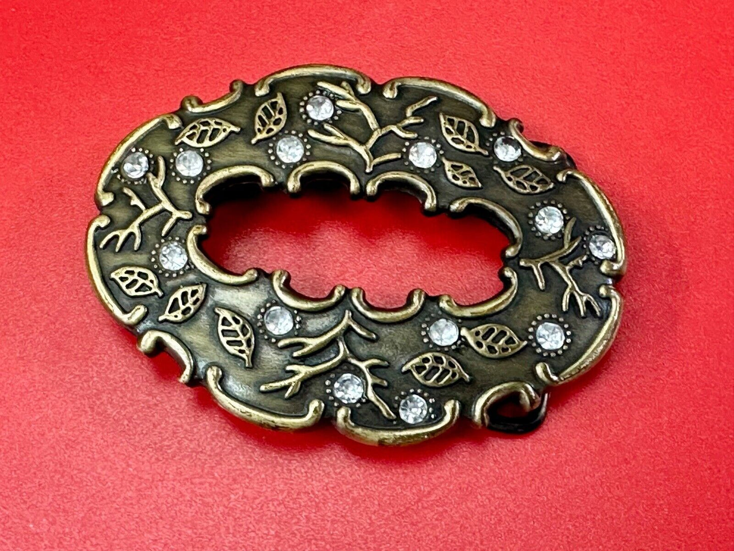 3" wide brown rhinestone accented leaf pattern semi oval belt buckle