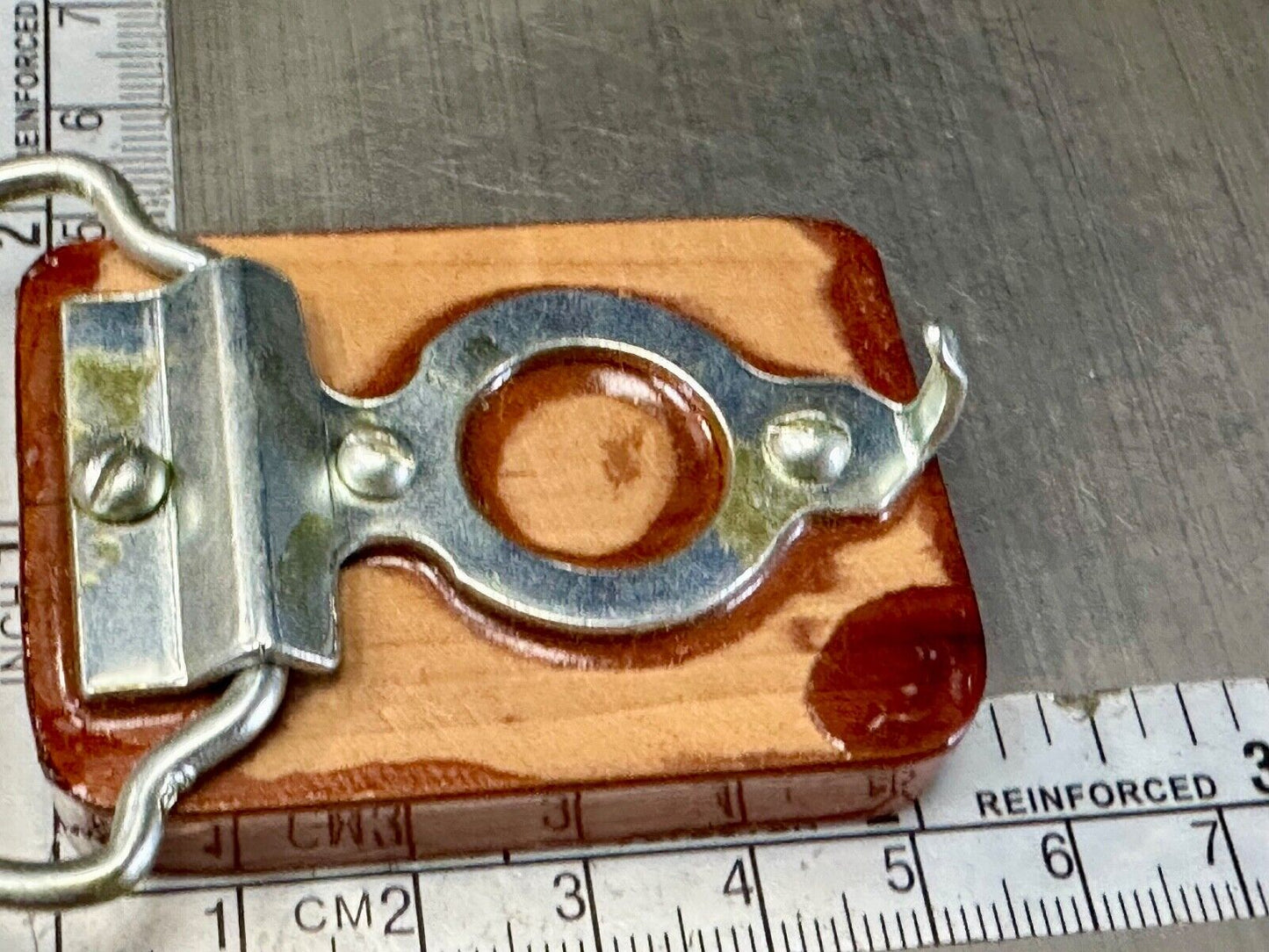 Artisan wood belt buckle with inlaid Luary Caverns cave token coin
