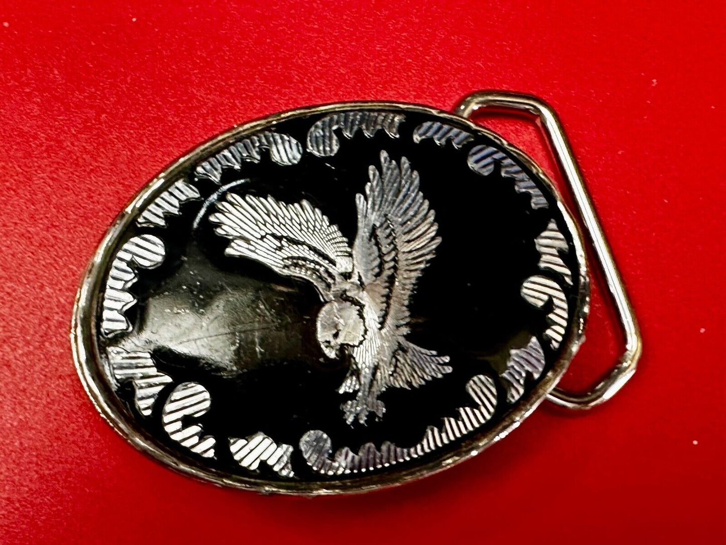 Black & silver tone Flying Eagle Oval Belt Buckle with "W" Mark. Made in U.S.A.
