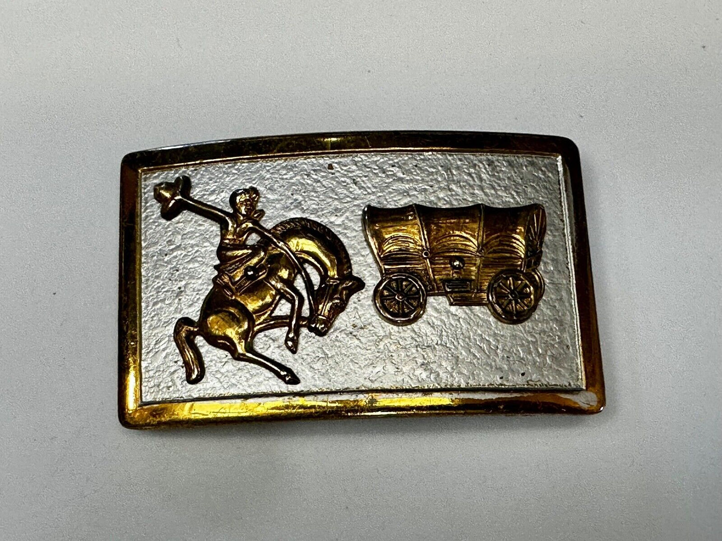Vintage Cowboy Saddle Bronc western Covered wagon gold tone belt buckle