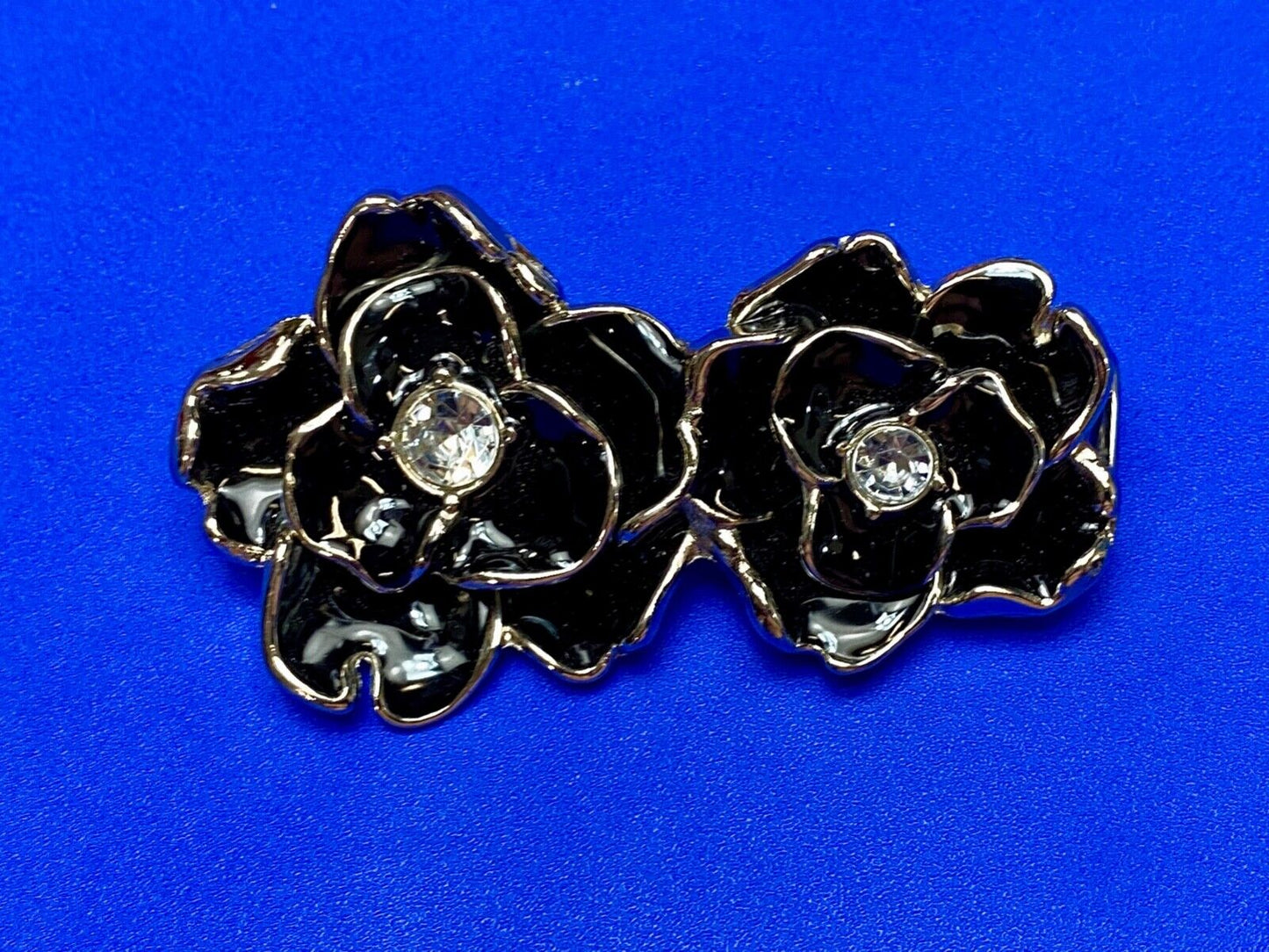 Beautiful two figural flowers with jewels as black & silver colored belt buckle