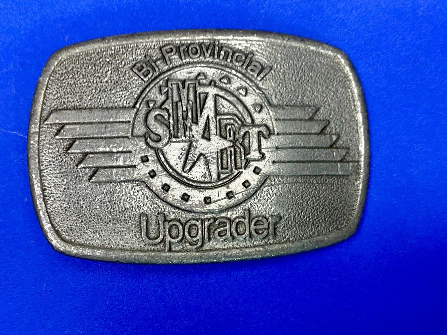 Bi-Provincial Smart Sm Art Upgrader Belt Buckle By Ad Ventures Studios