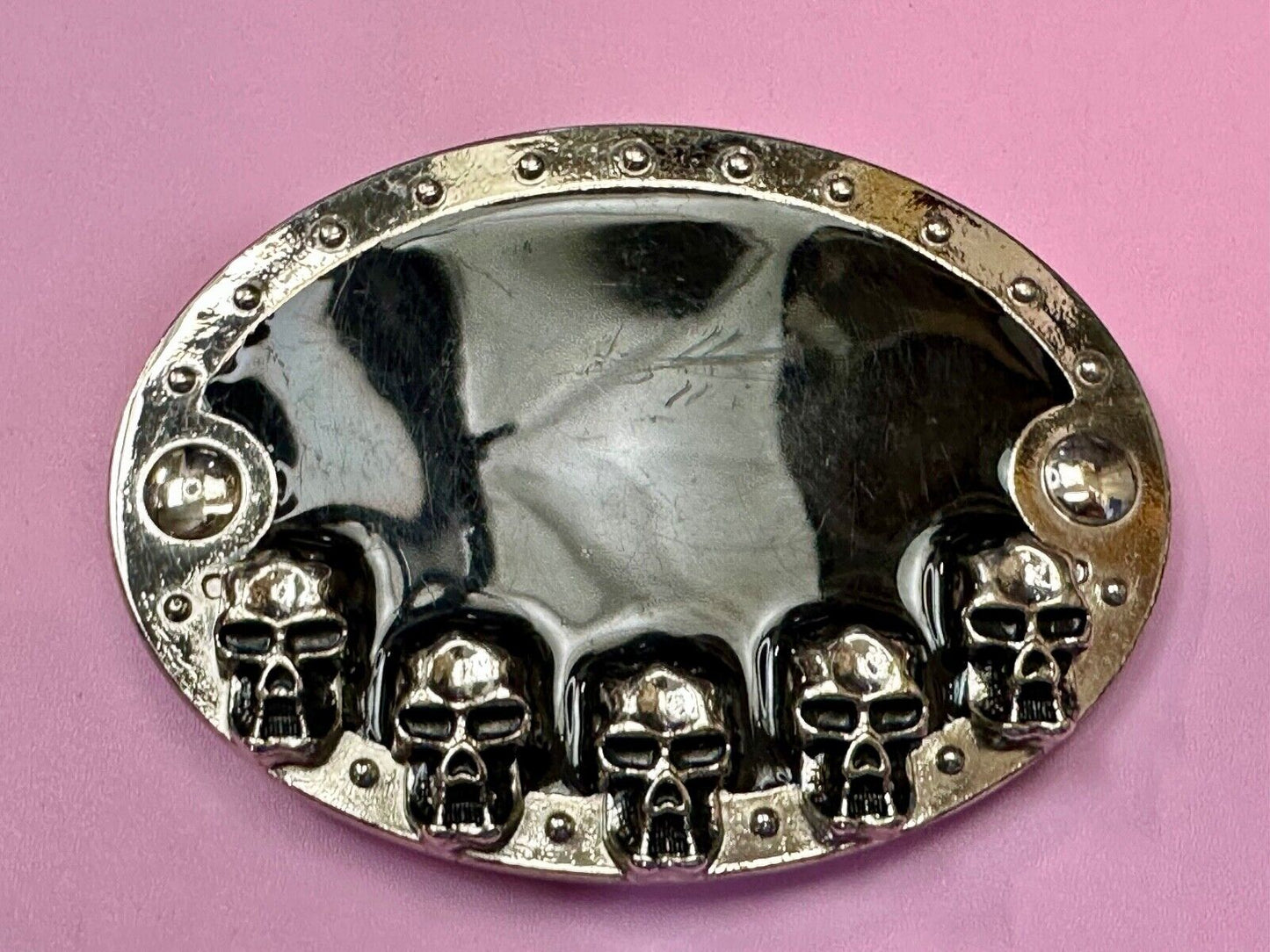Black and silver Belt Buckle with multiple skulls on boarder