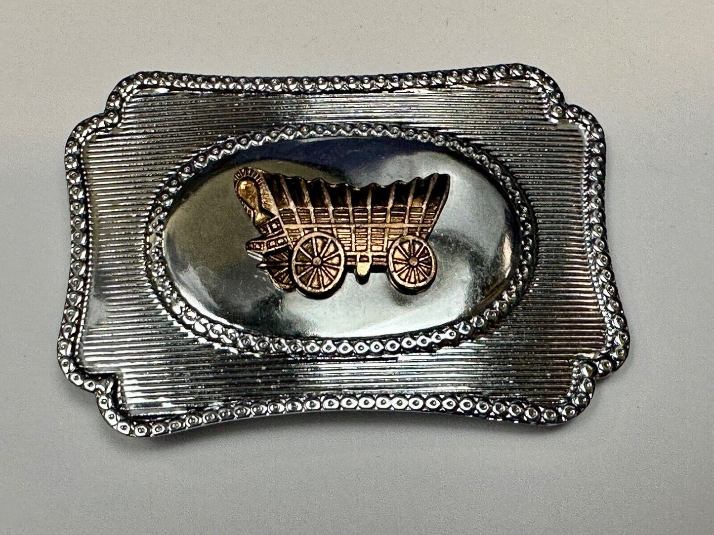 Vintage covered wagon western horse drawn transportation belt buckle