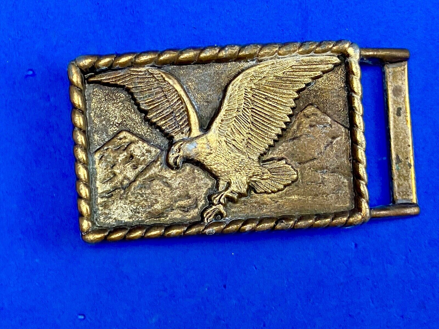 Vintage eagle flying over mountains belt buckle
