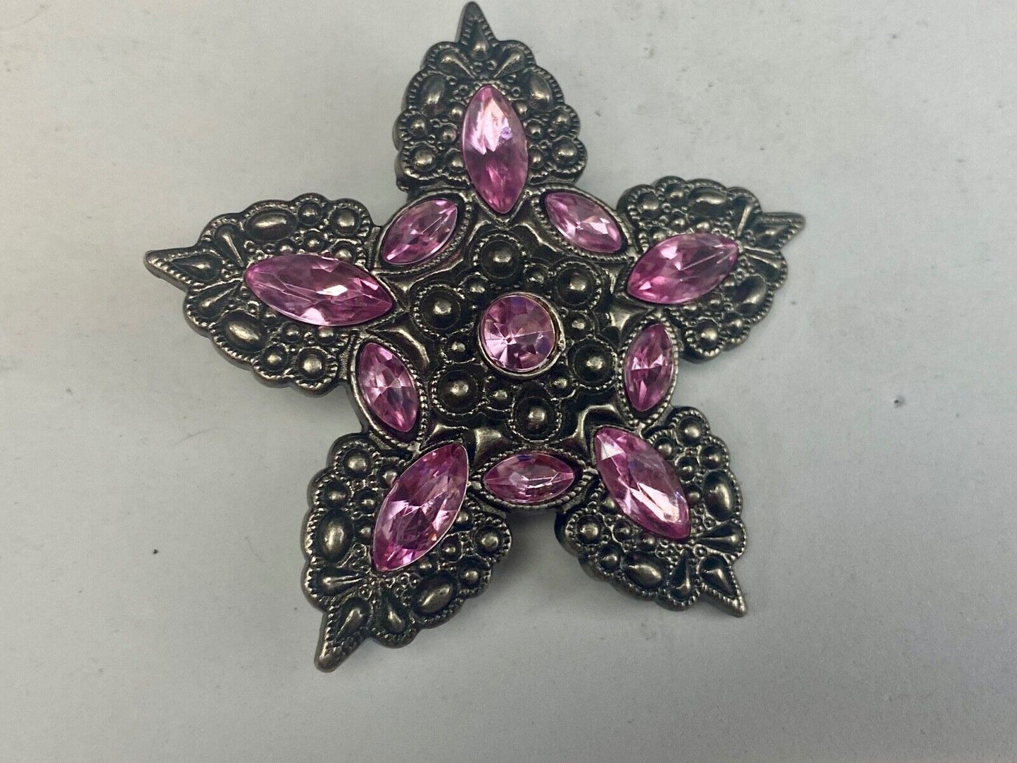 Beautiful figural star with pink accent rhinestones