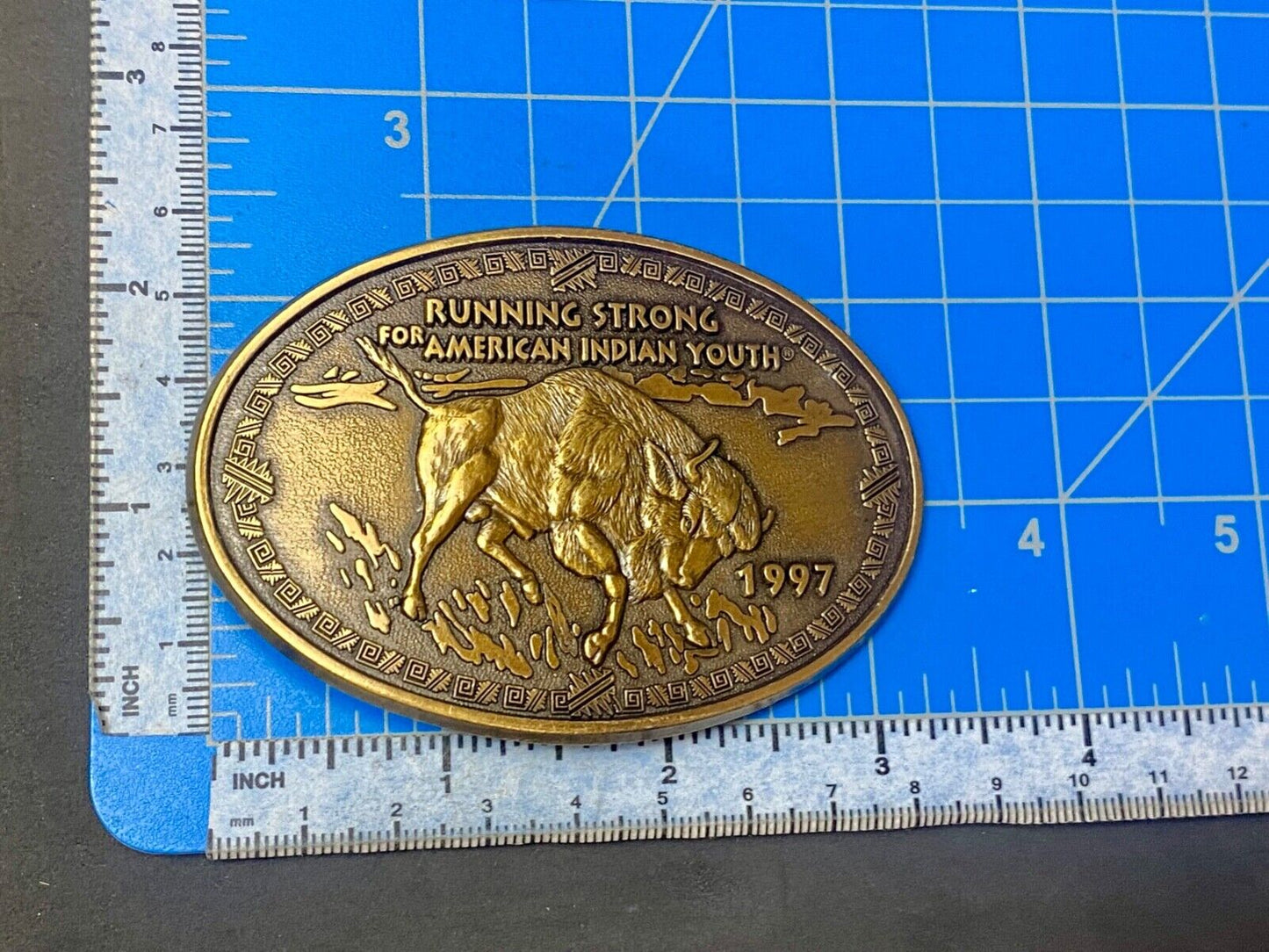 Vintage 1997 BUFFALO belt buckle RUNNING STRONG FOR AMERICAN INDIAN YOUTH