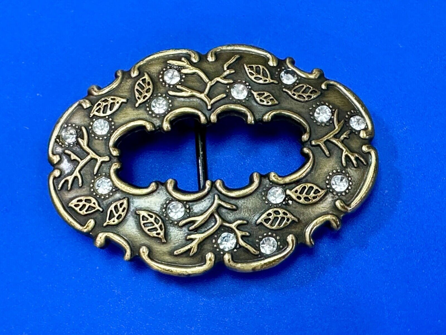 3" wide brown rhinestone accented leaf pattern semi oval belt buckle