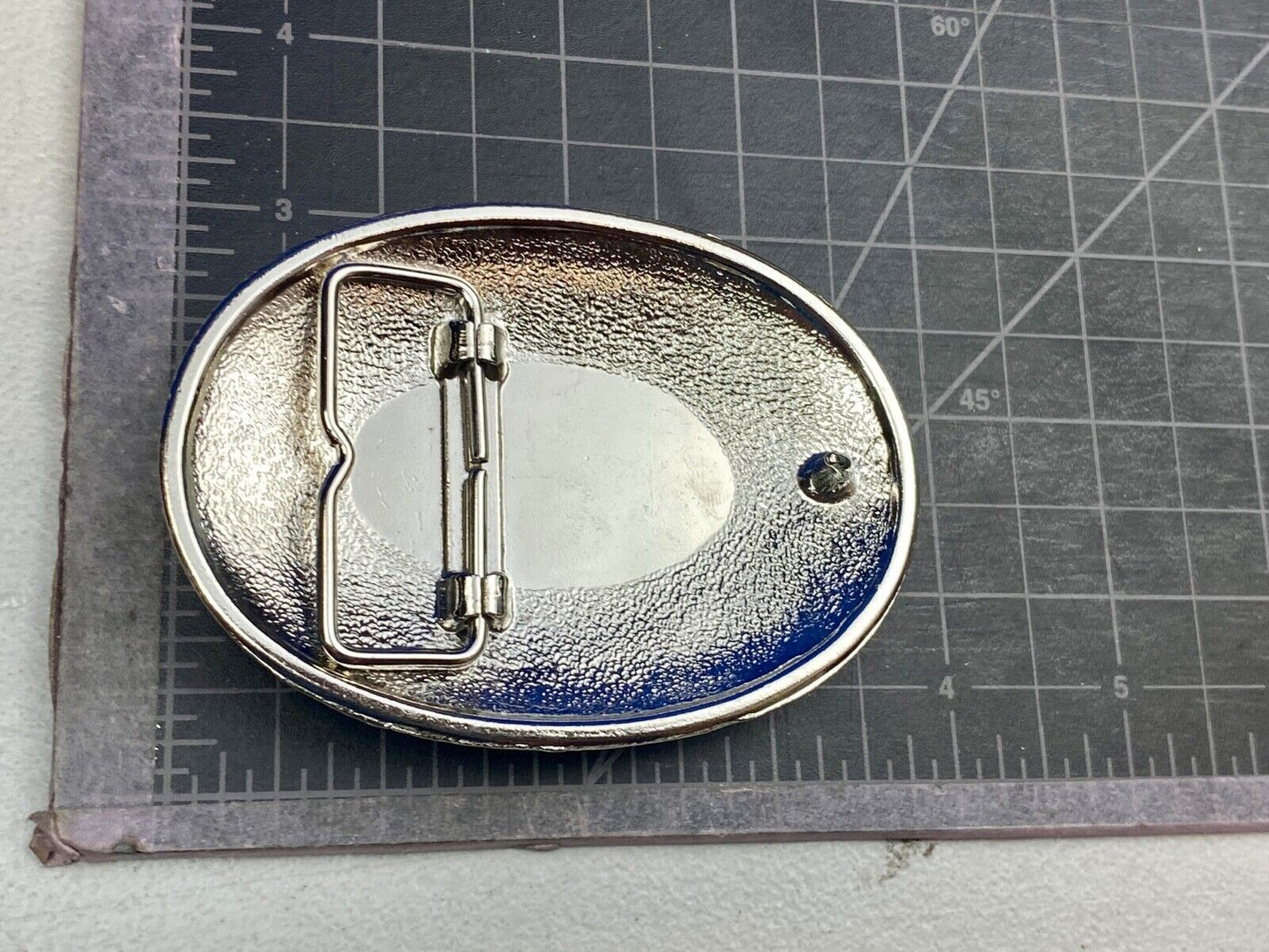 Beautiful belt buckle with centerpiece picture of Allied Cementing Company