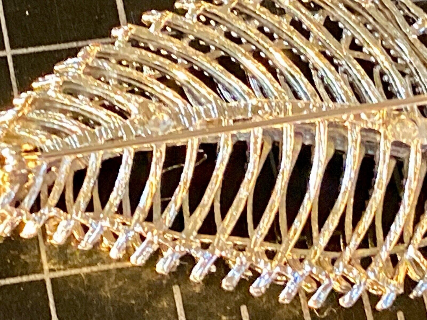 SWP INC signed Gold tone skeleton see through leaf brooch