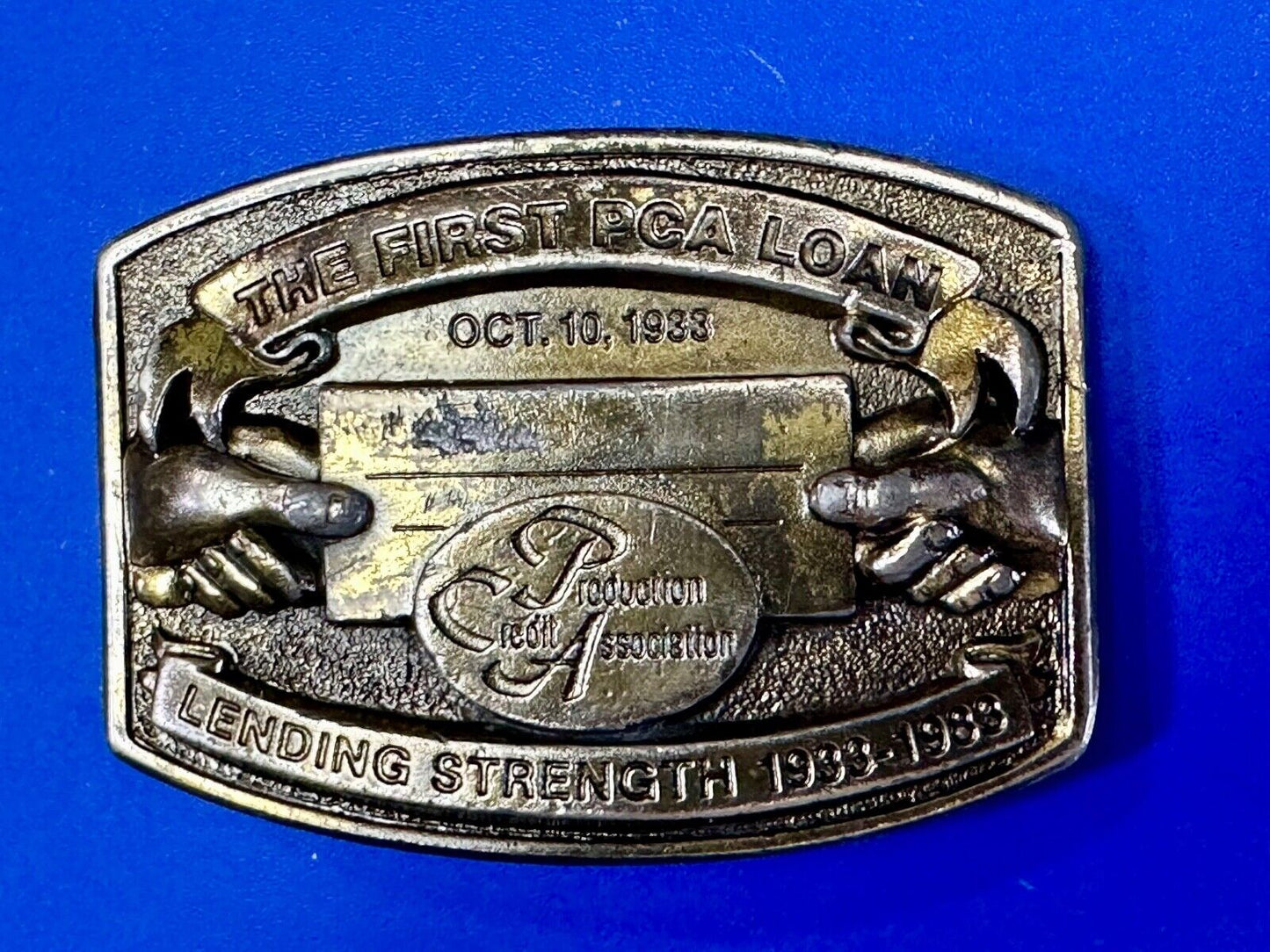 The First PCA loan Production Credit - Vintage The Great American Belt Buckle Co