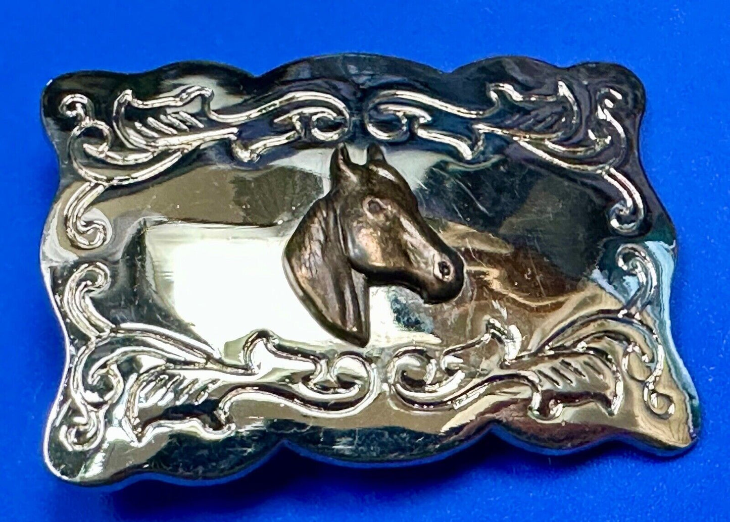 Vintage horse head centered on western rectangular two tone belt buckle