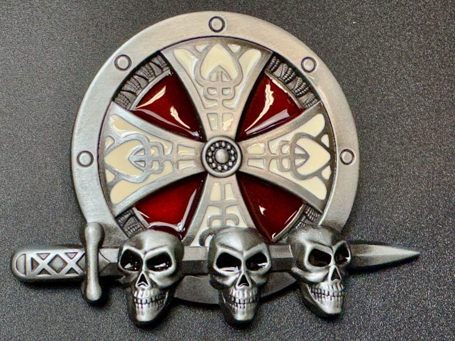 Three skulls with sword through heads on Iron Cross round NOS belt buckle