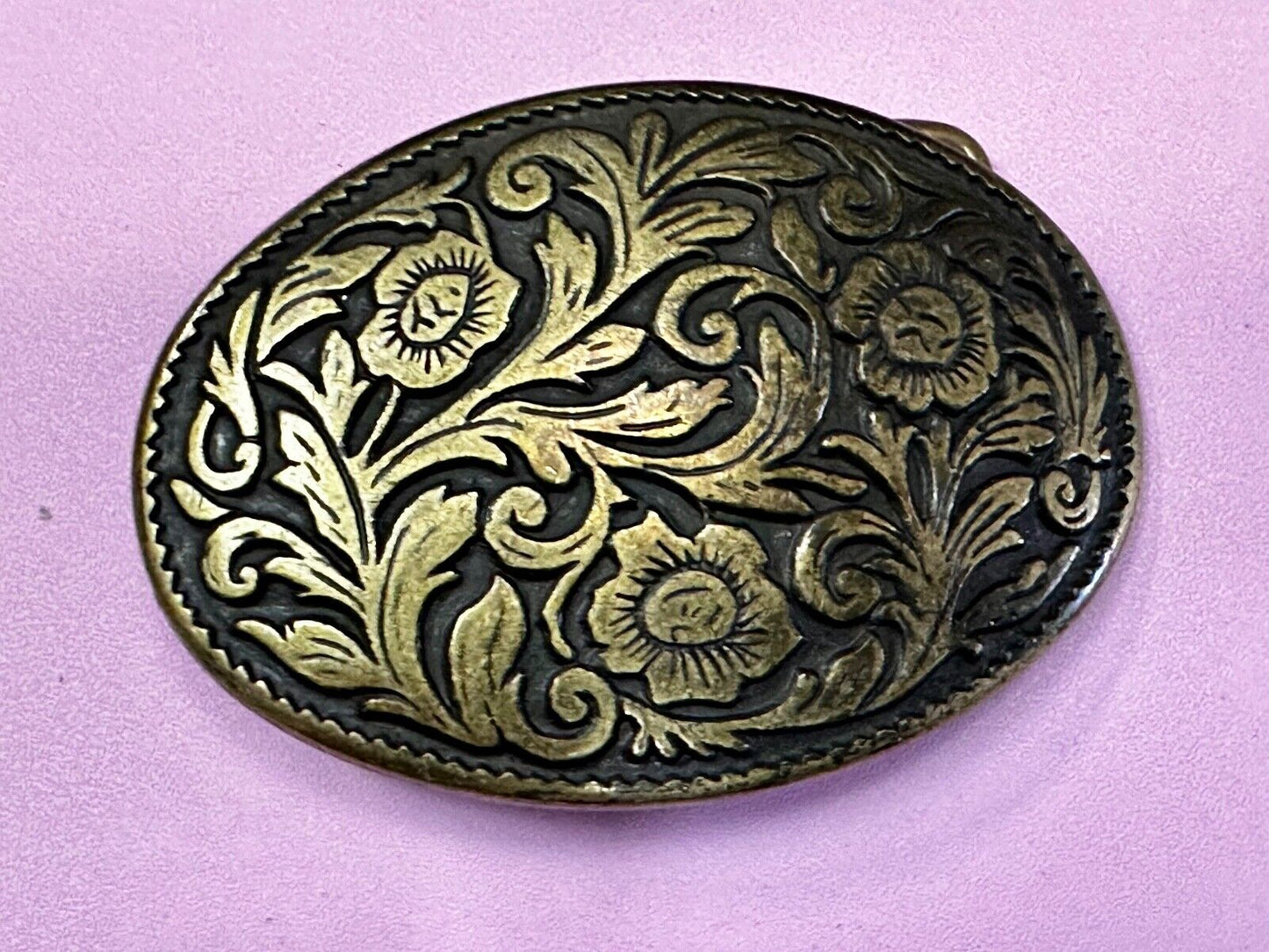 Vintage black and gold tone western flower floral theme cowboys belt buckle