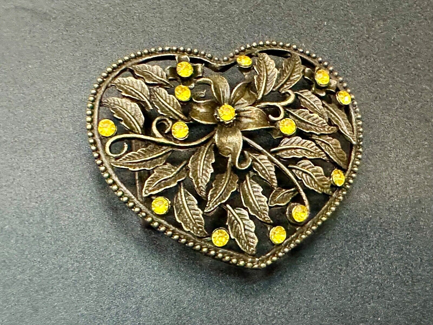 Beautiful see through Heart shaped belt buckle with yellow rhinestone accents