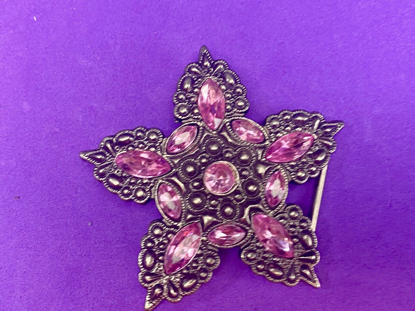 Beautiful figural star with pink accent rhinestones