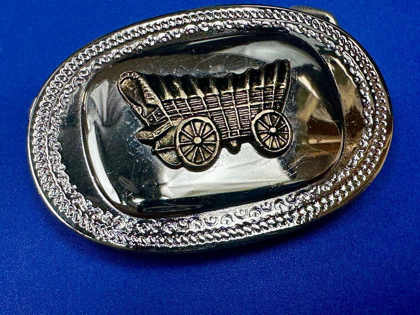 Vintage Covered Wagon on reflective oval two tone western belt buckle
