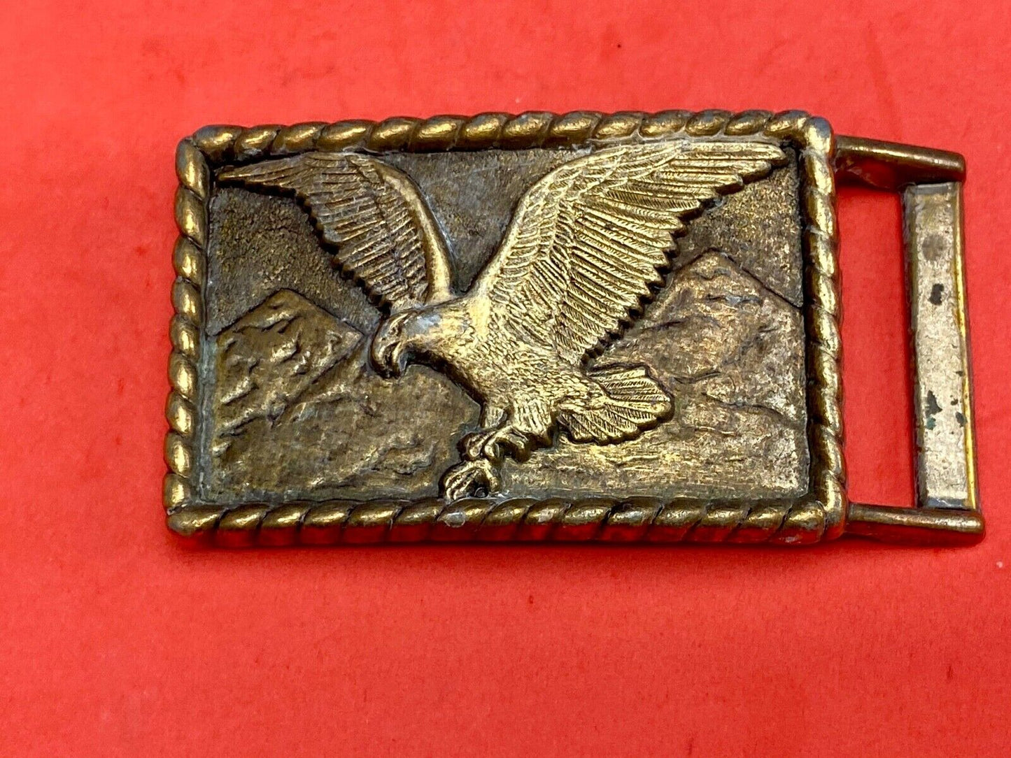 Vintage eagle flying over mountains belt buckle