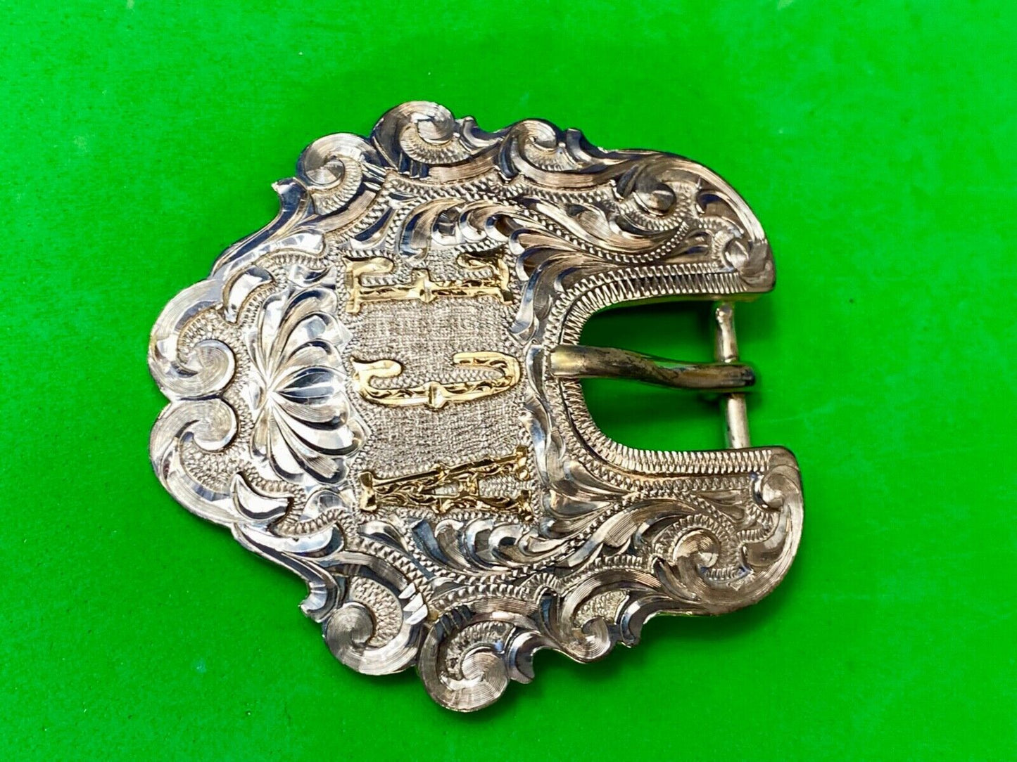 Vintage ACE Western cowboys flower swirl belt buckle design by DALE Chavez