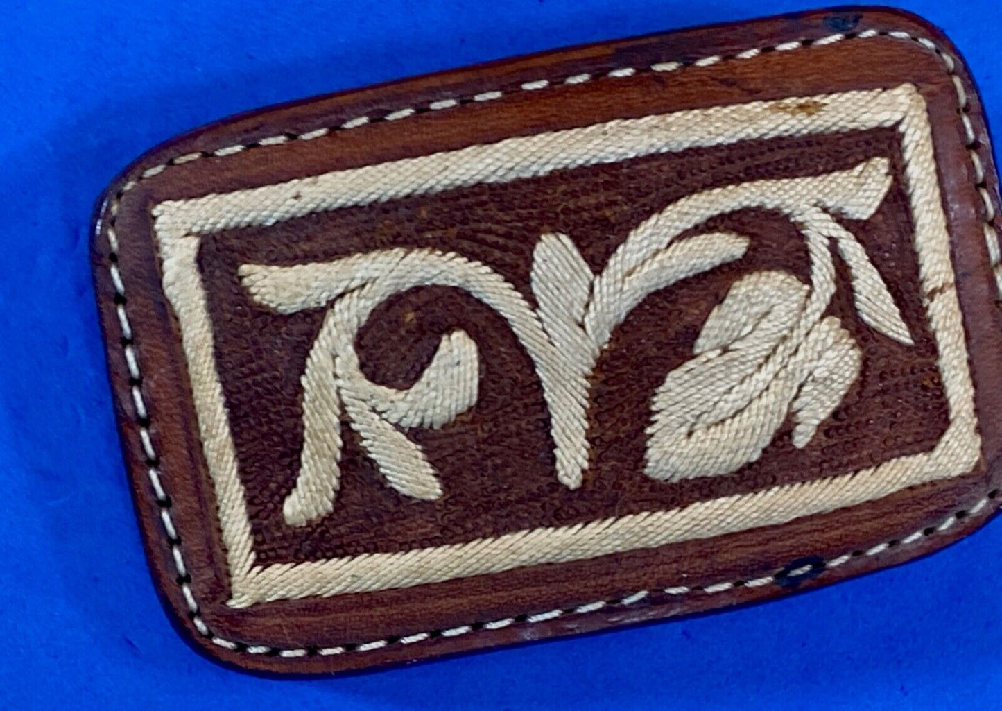 Vintage embroidered flower theme on brown leather belt buckle