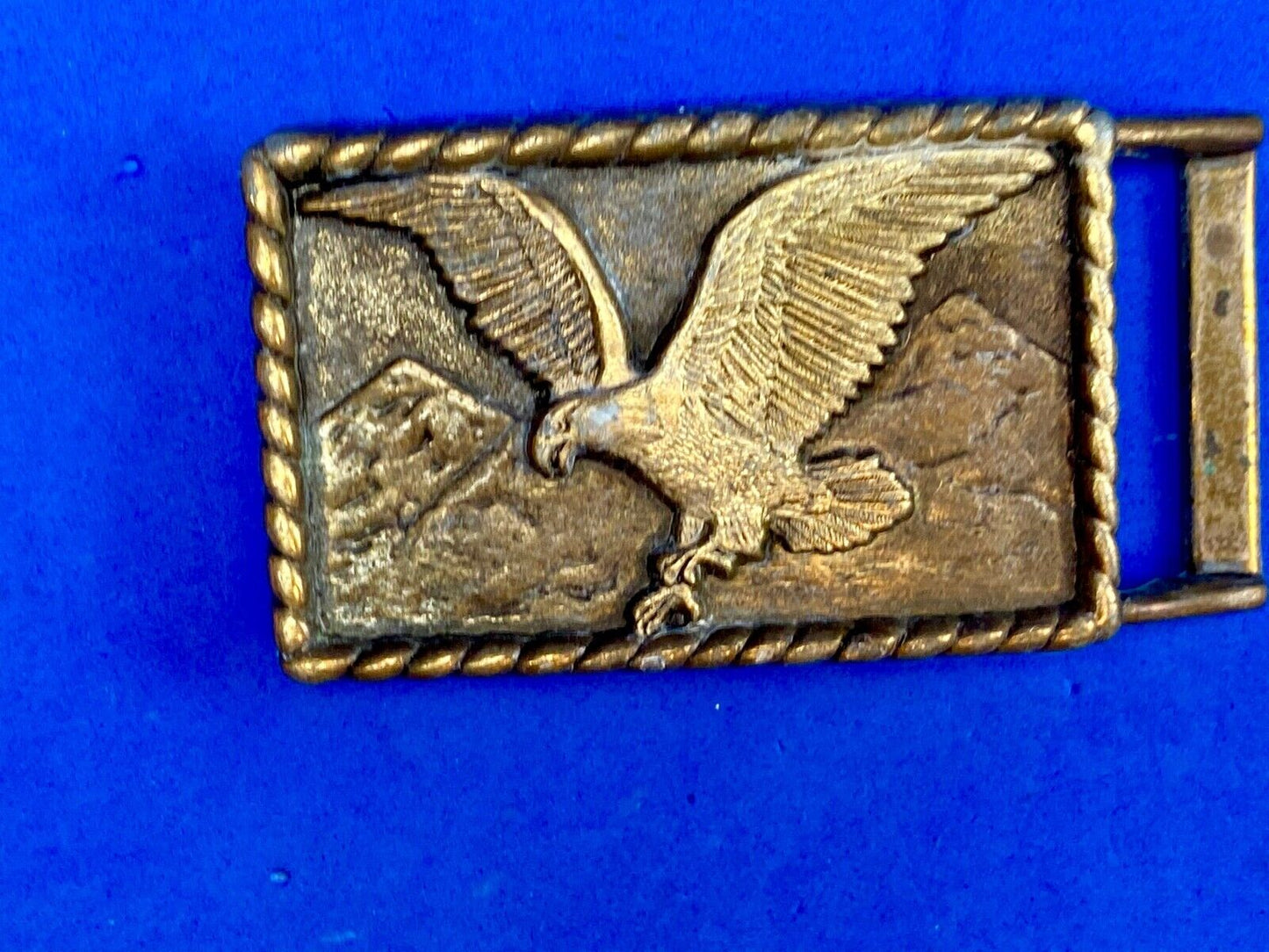 Vintage eagle flying over mountains belt buckle