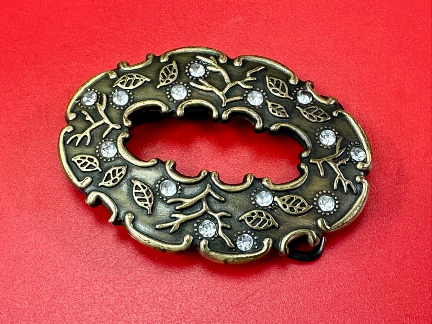 3" wide brown rhinestone accented leaf pattern semi oval belt buckle