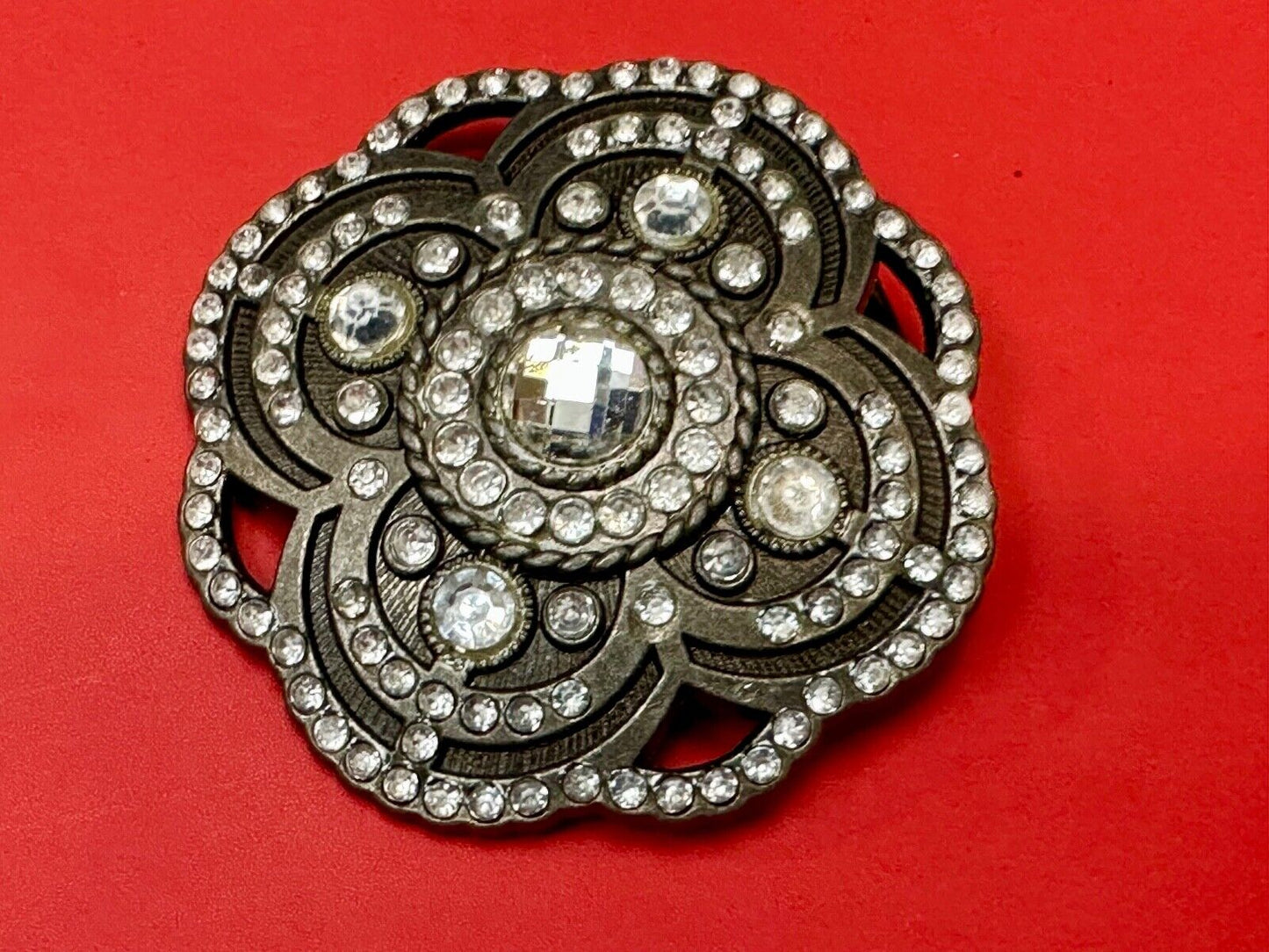 Beautiful Rhinestone accented see through flower shaped cutout belt buckle