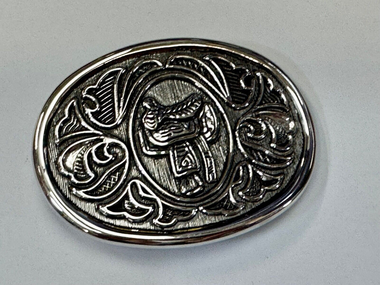 Vintage Cowboy's Horse Saddle ornate flower swirl oval belt buckle by Avon