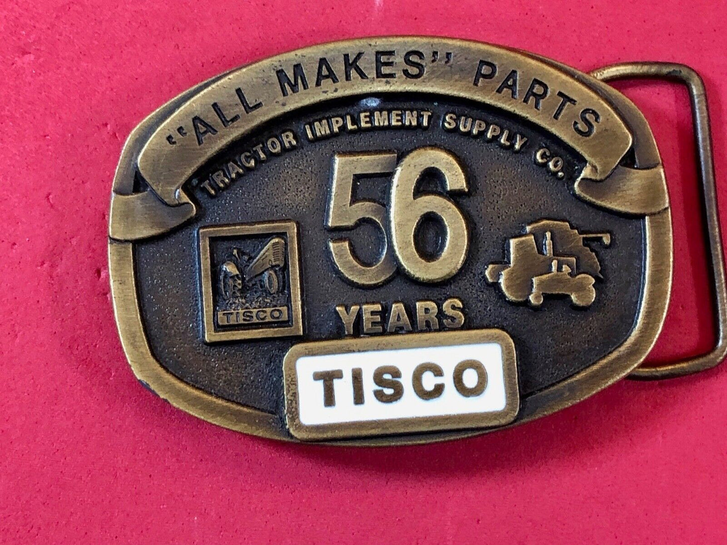 TISCO - 56 years tractor farming parts supply store advertising belt buckle