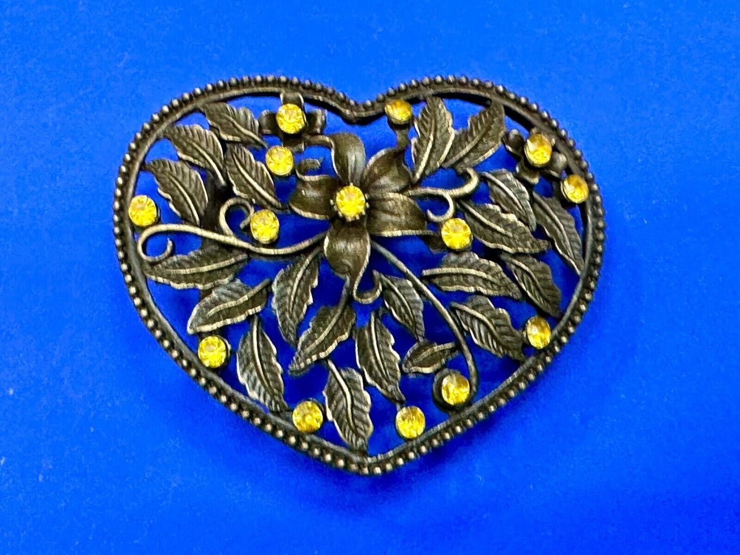Beautiful see through Heart shaped belt buckle with yellow rhinestone accents