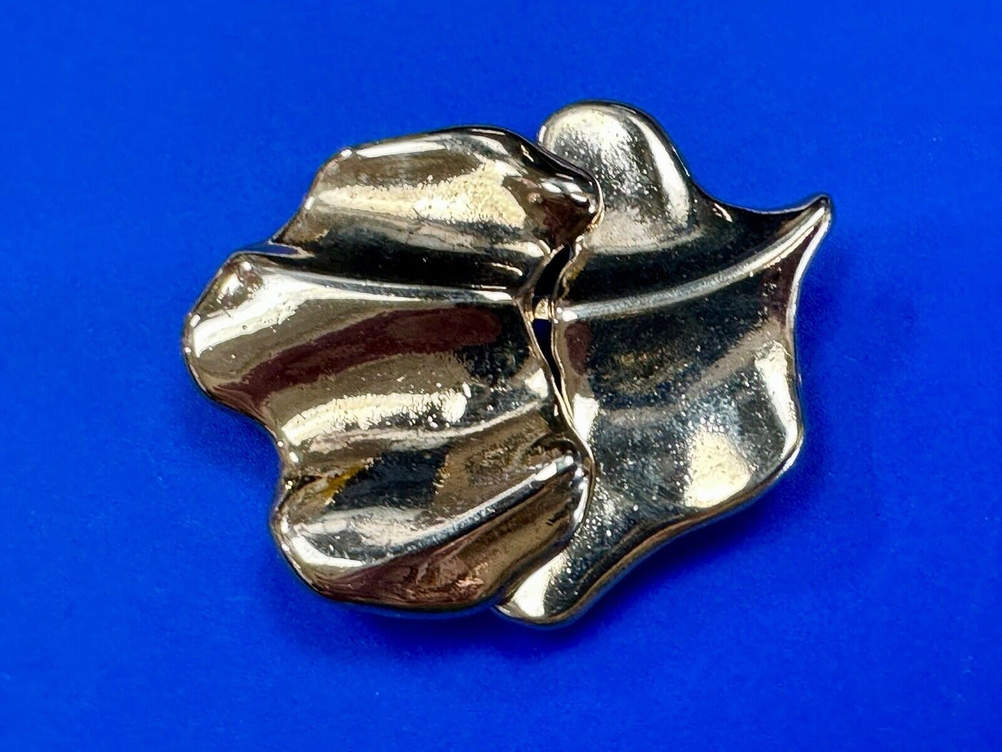 Two-piece interlocking gold tone leaf swirl theme belt slide buckle signed _____